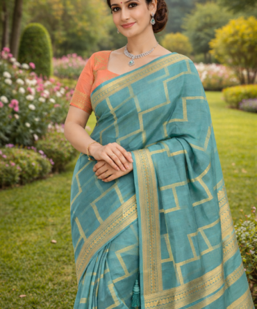 Sea Green Crepe Saree with Peach Designer Blouse